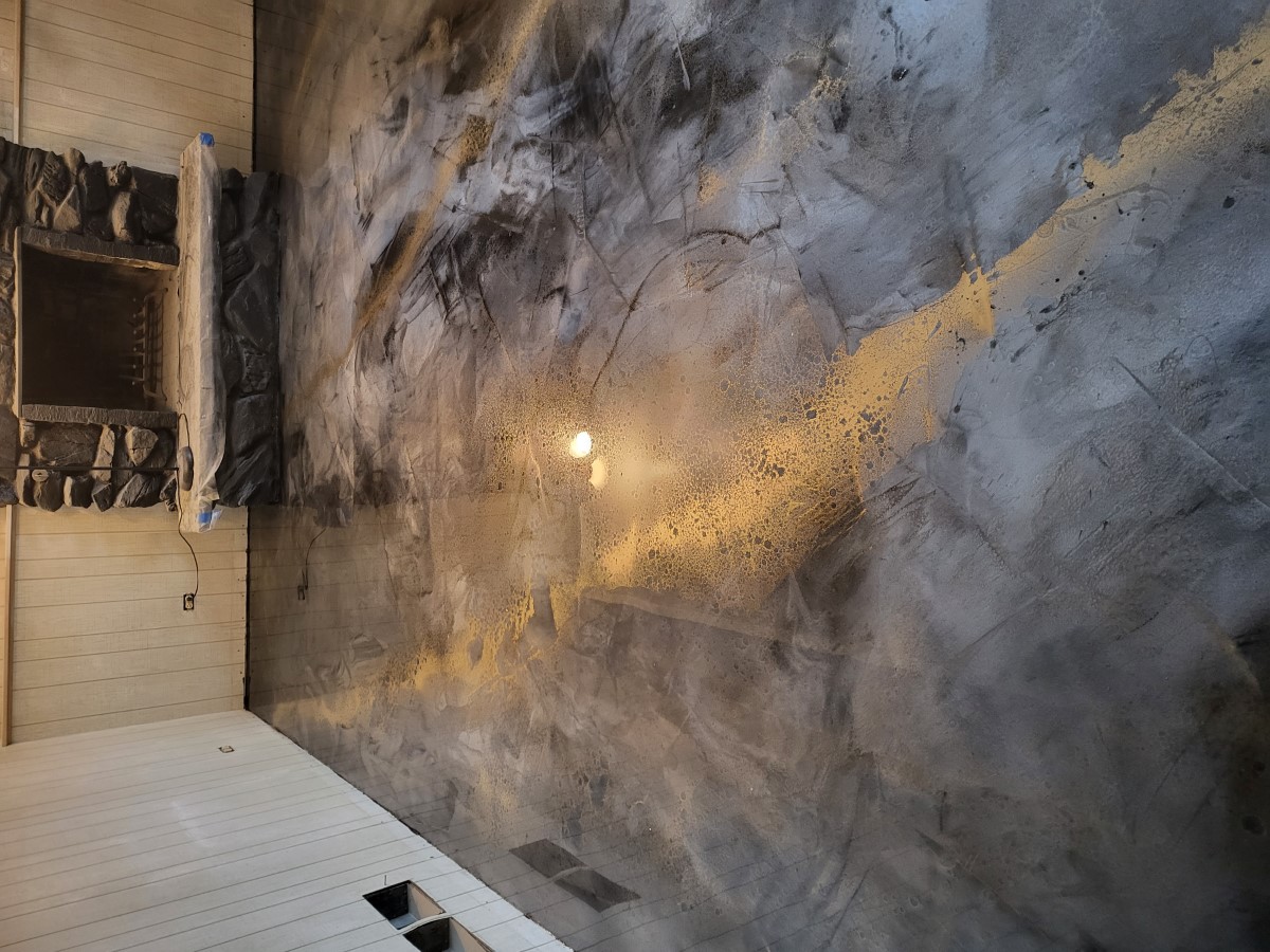 Room with metallic epoxy flooring reflecting light