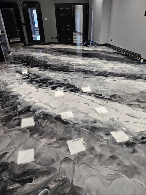 Metallic epoxy floor poured across a business interior
