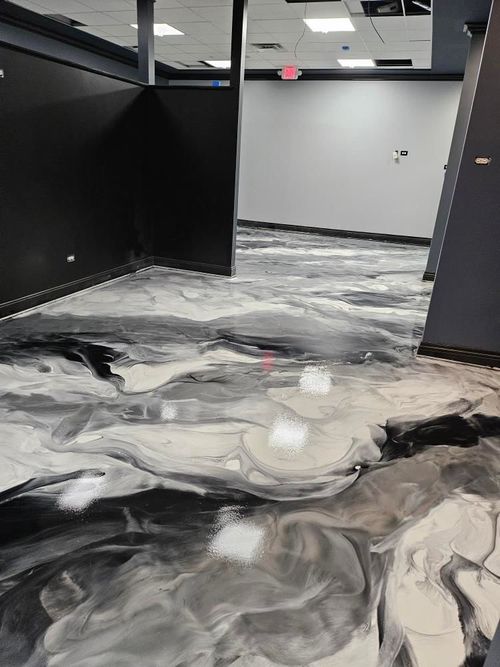 White and black metallic epoxy floor in a finished room