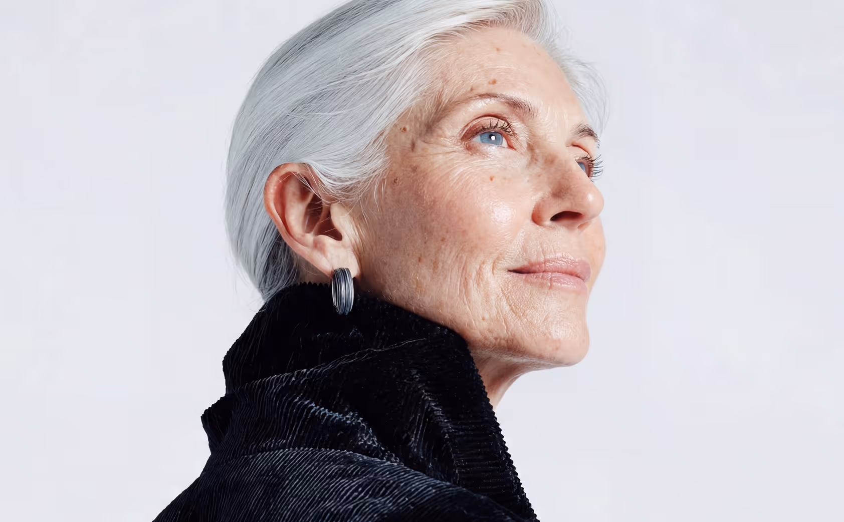 Woman looking up thoughtfully
