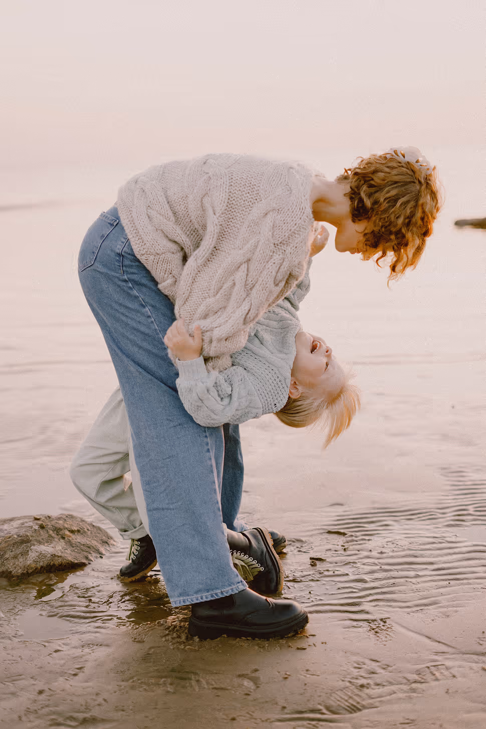Two boys playing together at home