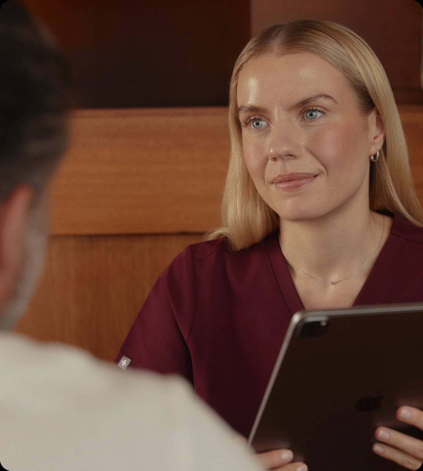 Superpower clinician reviewing a care plan on a tablet
