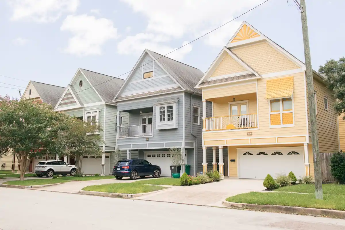 Colorful two-story homes on a residential street in Houston, Texas