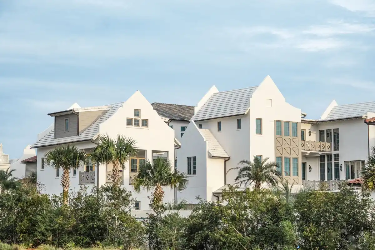 White gabled homes with palm trees in Alys Beach, Florida