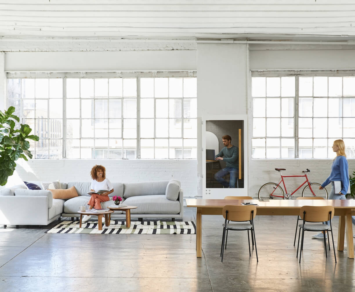 A living room filled with furniture and lots of windows