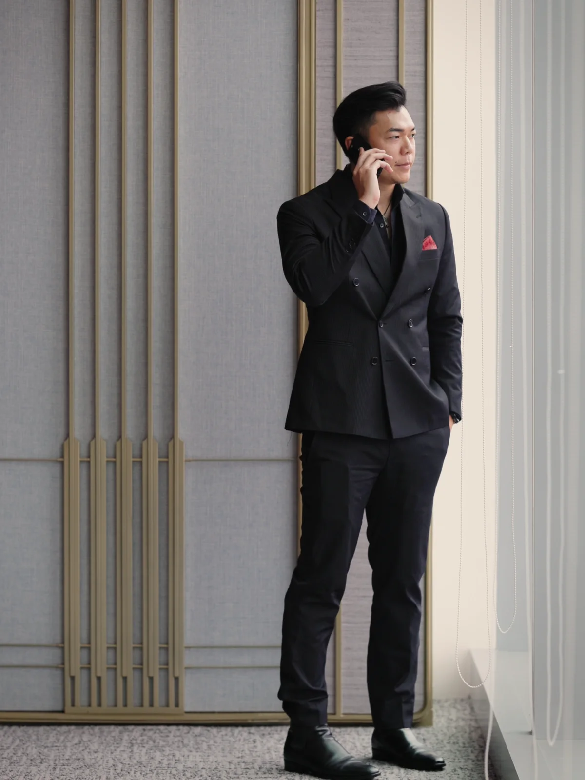 Deejai Riangkrul standing, full-length portrait.