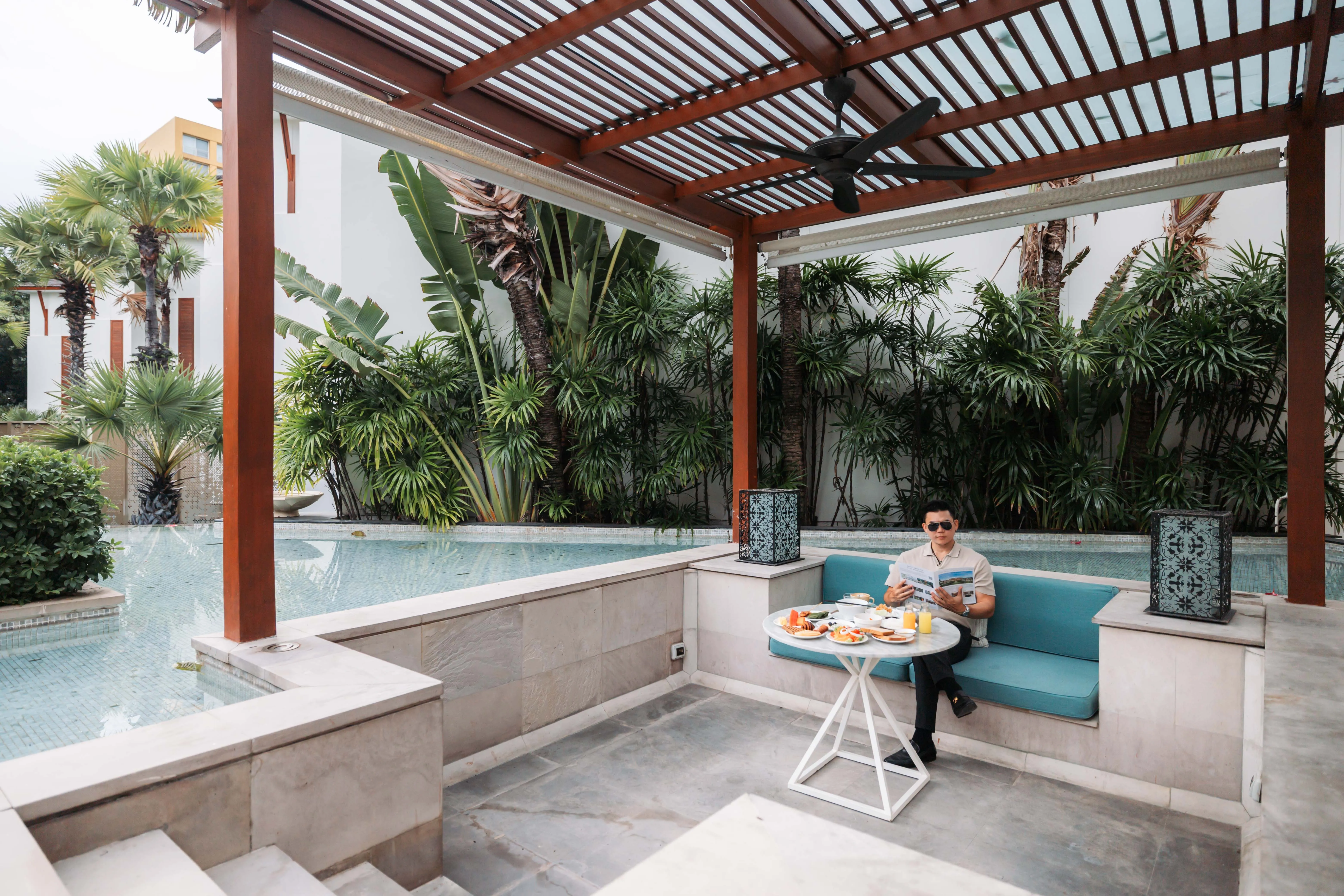 Breakfast served beside the private pool of a beachfront villa
