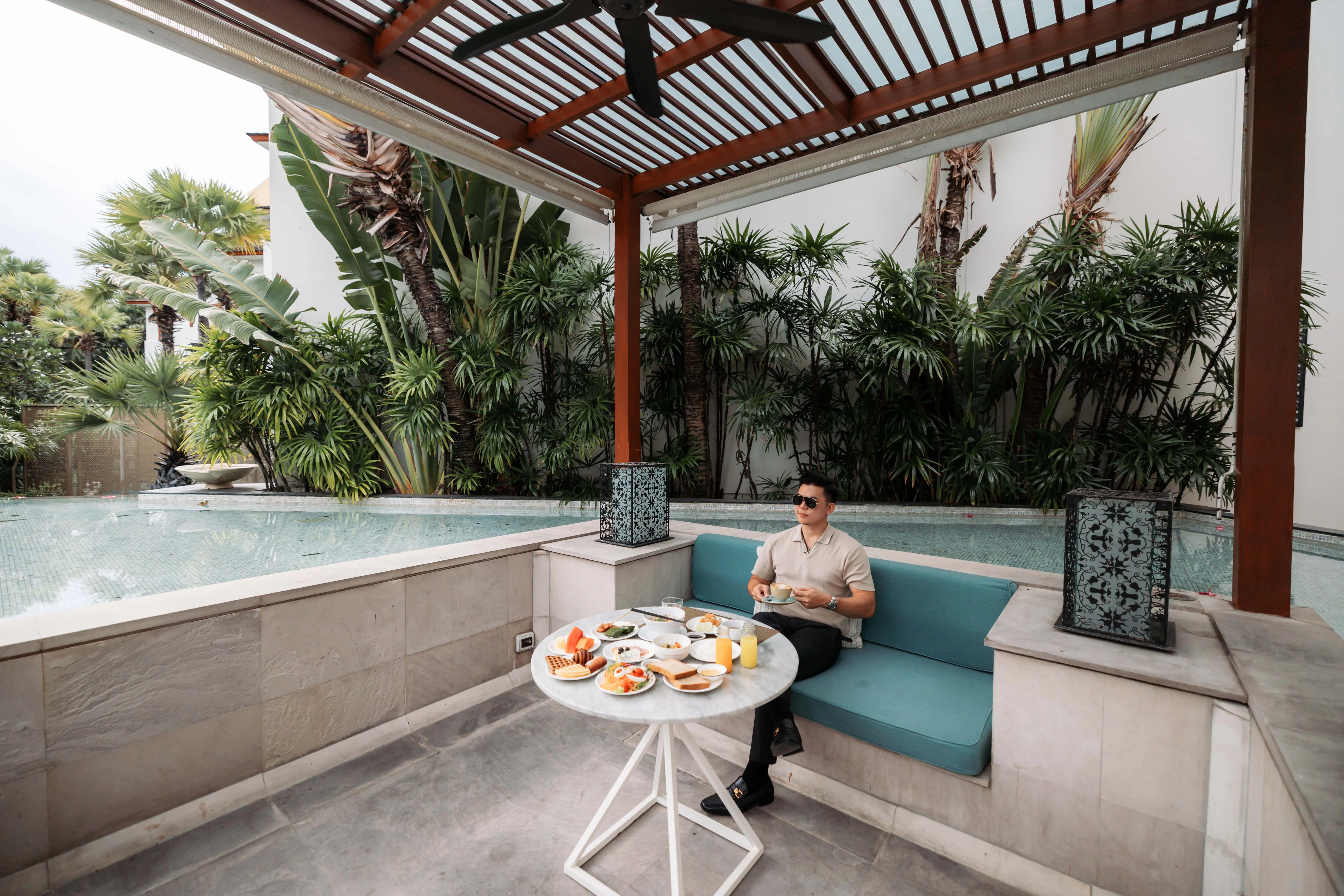 Breakfast served on a poolside daybed at InterContinental Hua Hin