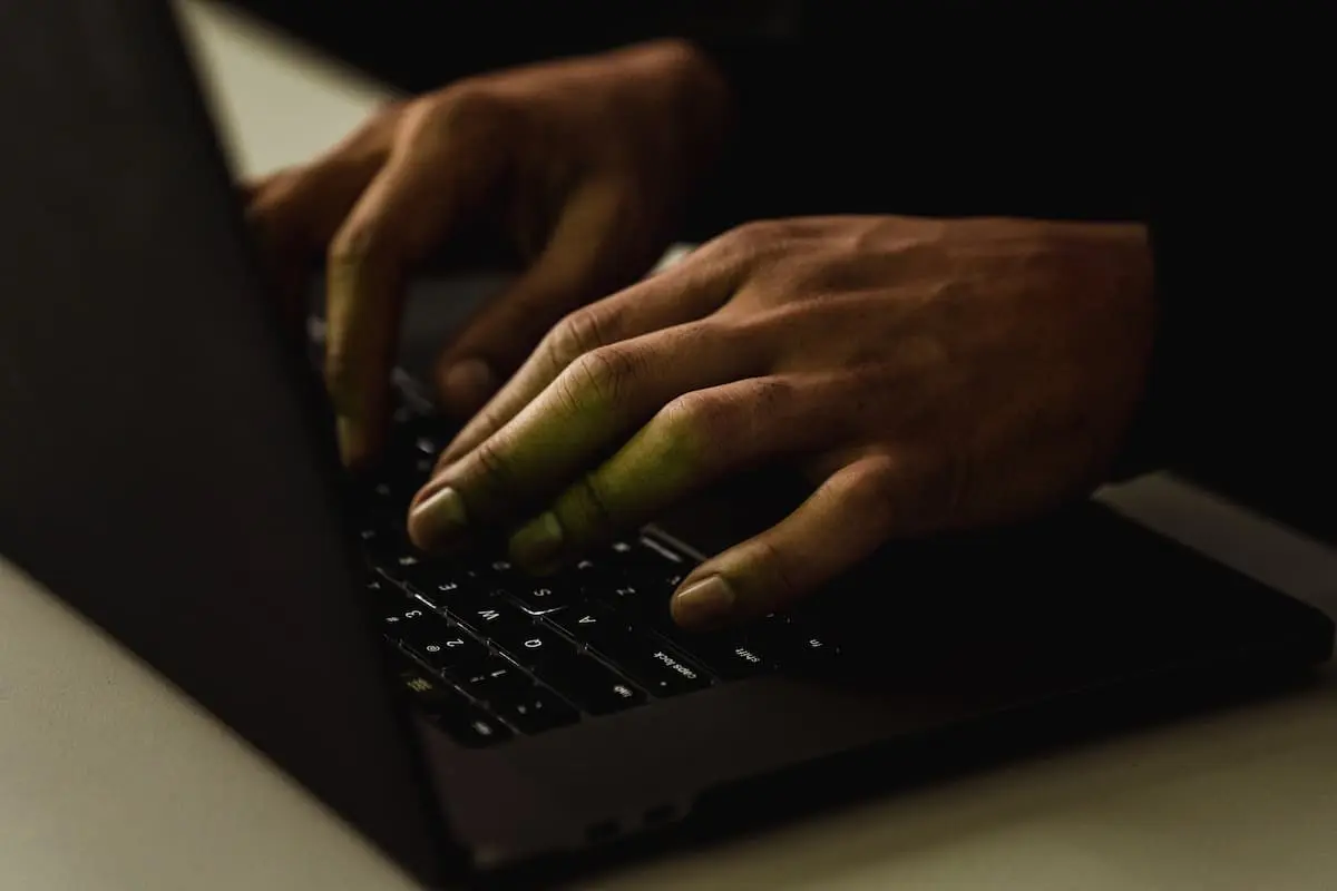 A man works on a laptop