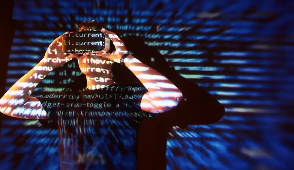 an image of a person in VR glasses with a code reflaction on the body and background
