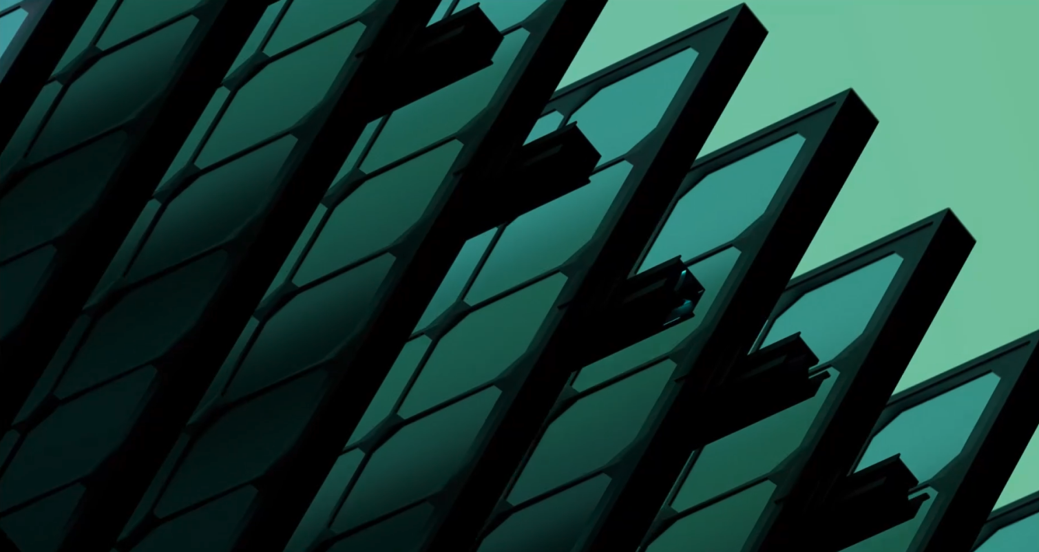 Close-up of green-tinted, angled glass panels with black frames against a light green background.