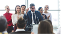 A group of people in a meeting
