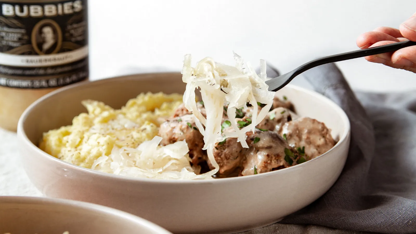 Traditional German Meatballs with Mashed Potatoes and Sauerkraut