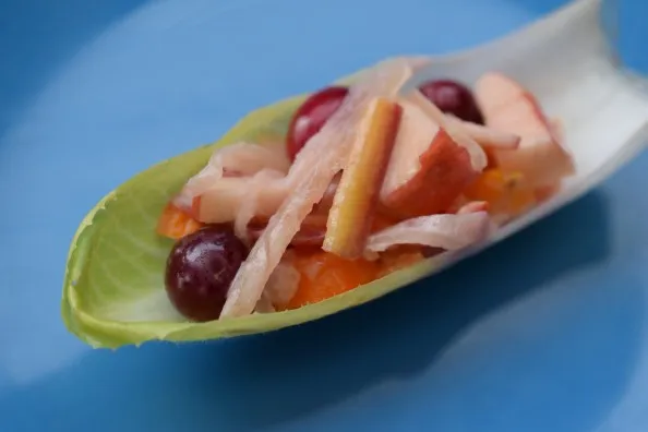 cranberry apple sauerkraut slaw in lettuce leaf