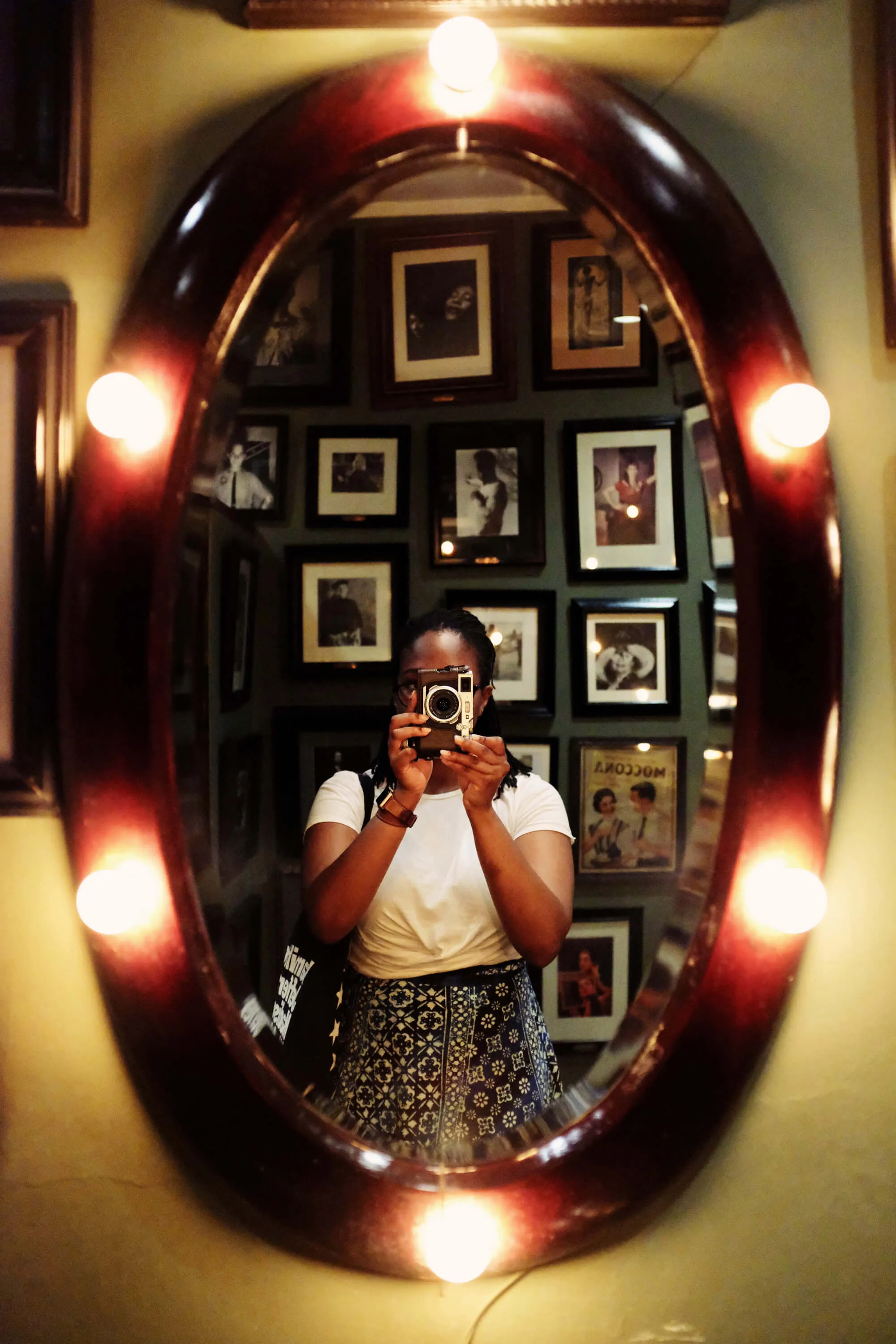 a person taking a picture of herself in a mirror