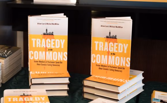 Book cover with the title "Tragedy in the Commons: Former Members of Parliament Speak Out about Canada's Failing Democracy" and background photography of the Parliament of Canada and it's elongated reflection below it like an iceberg. 