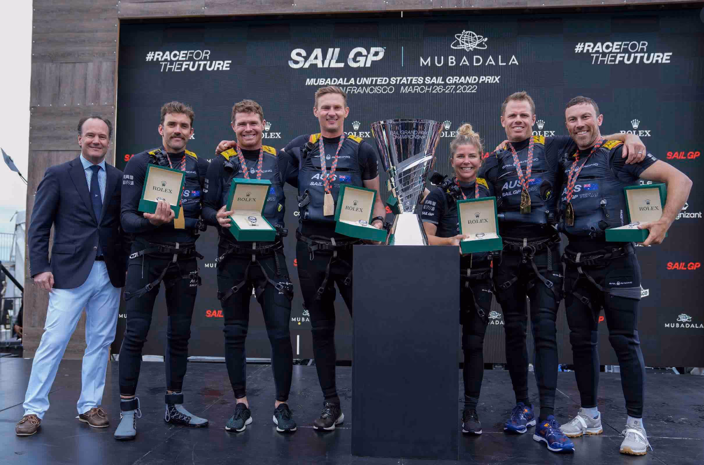 The Australian sailing team collecting their medals whilst all holding Rolex watches
