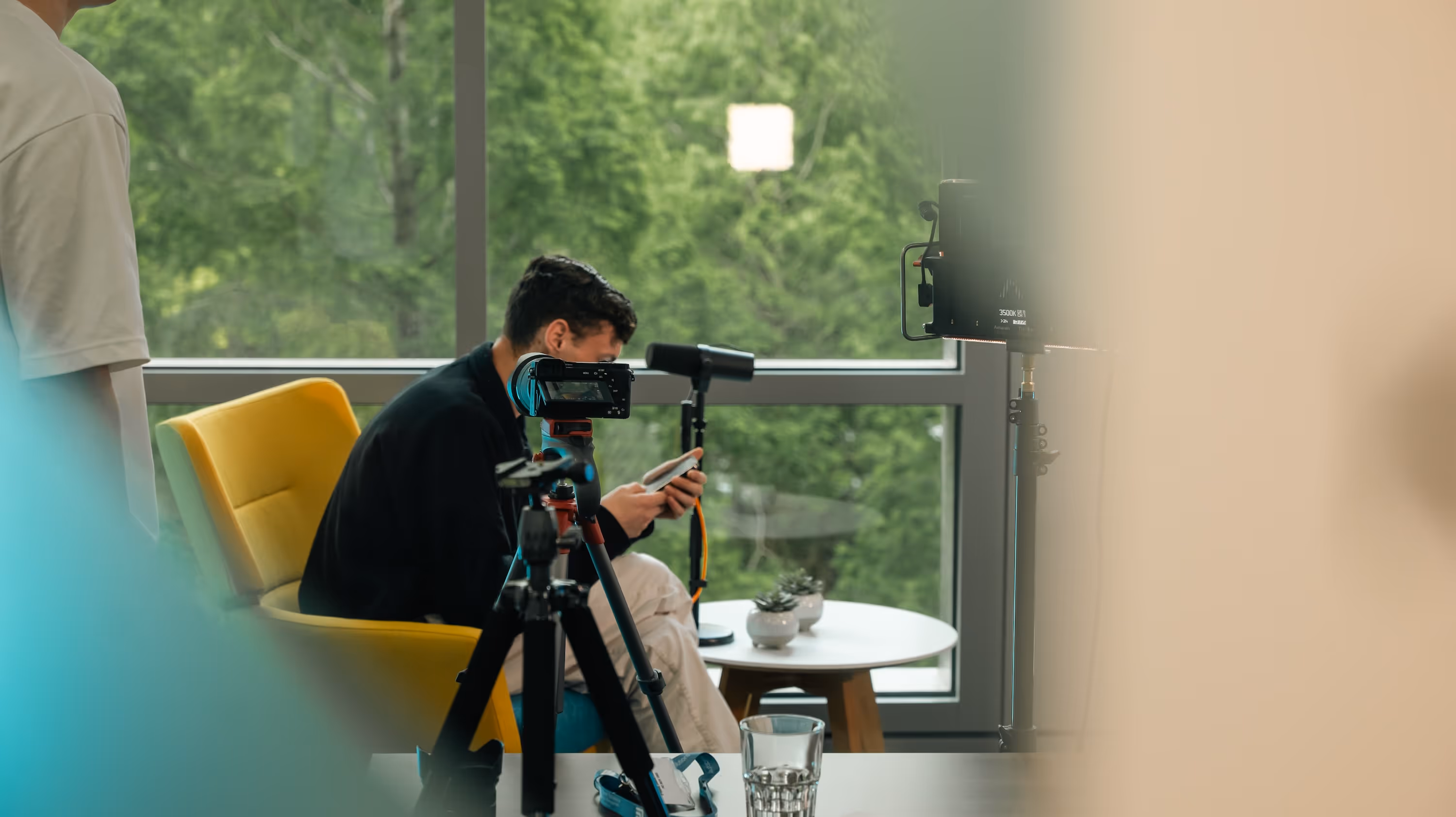 Podcast production with video camera, lighting and audio equipment recording a podcast show.