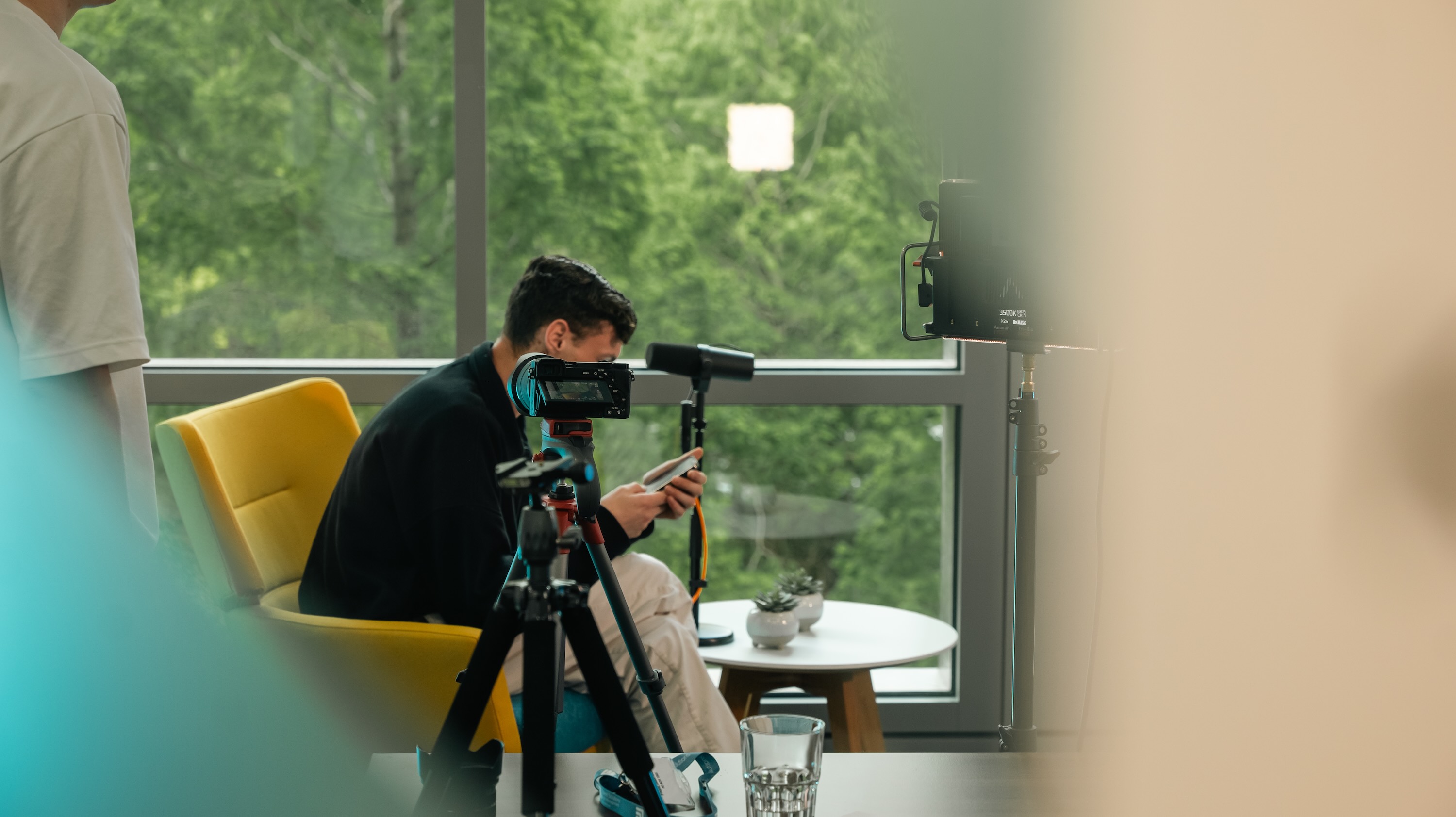 Podcast production with video camera, lighting and audio equipment recording a podcast show.