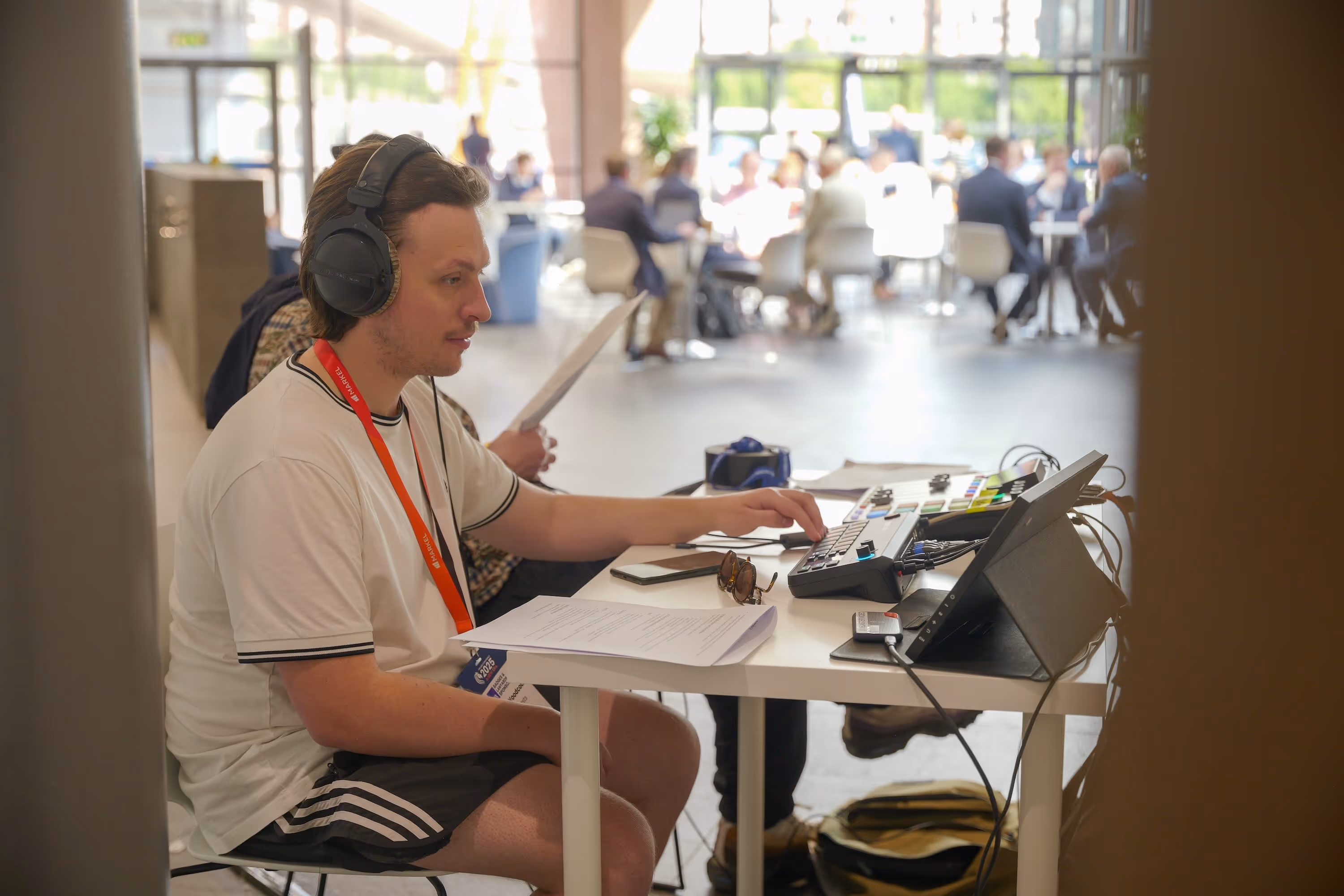 Podcast producer at work recording on location show.