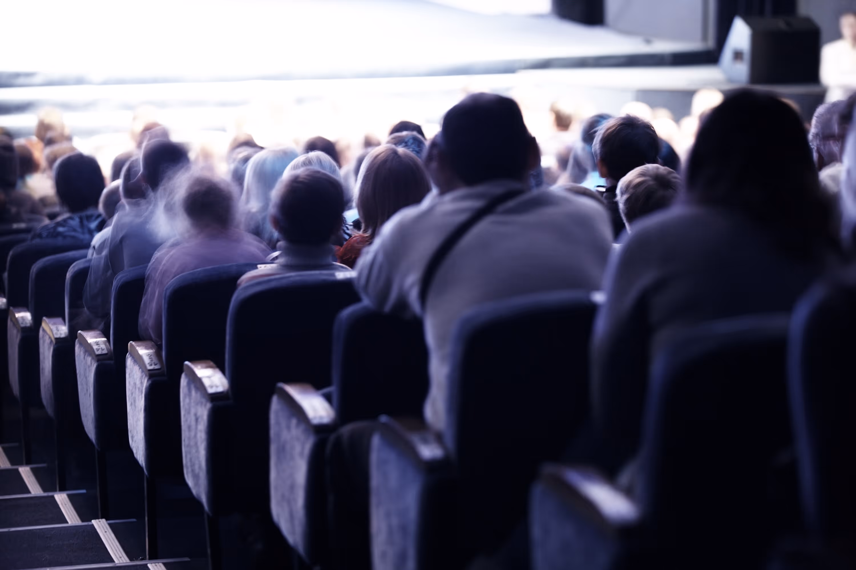 Seated audience attending a live event