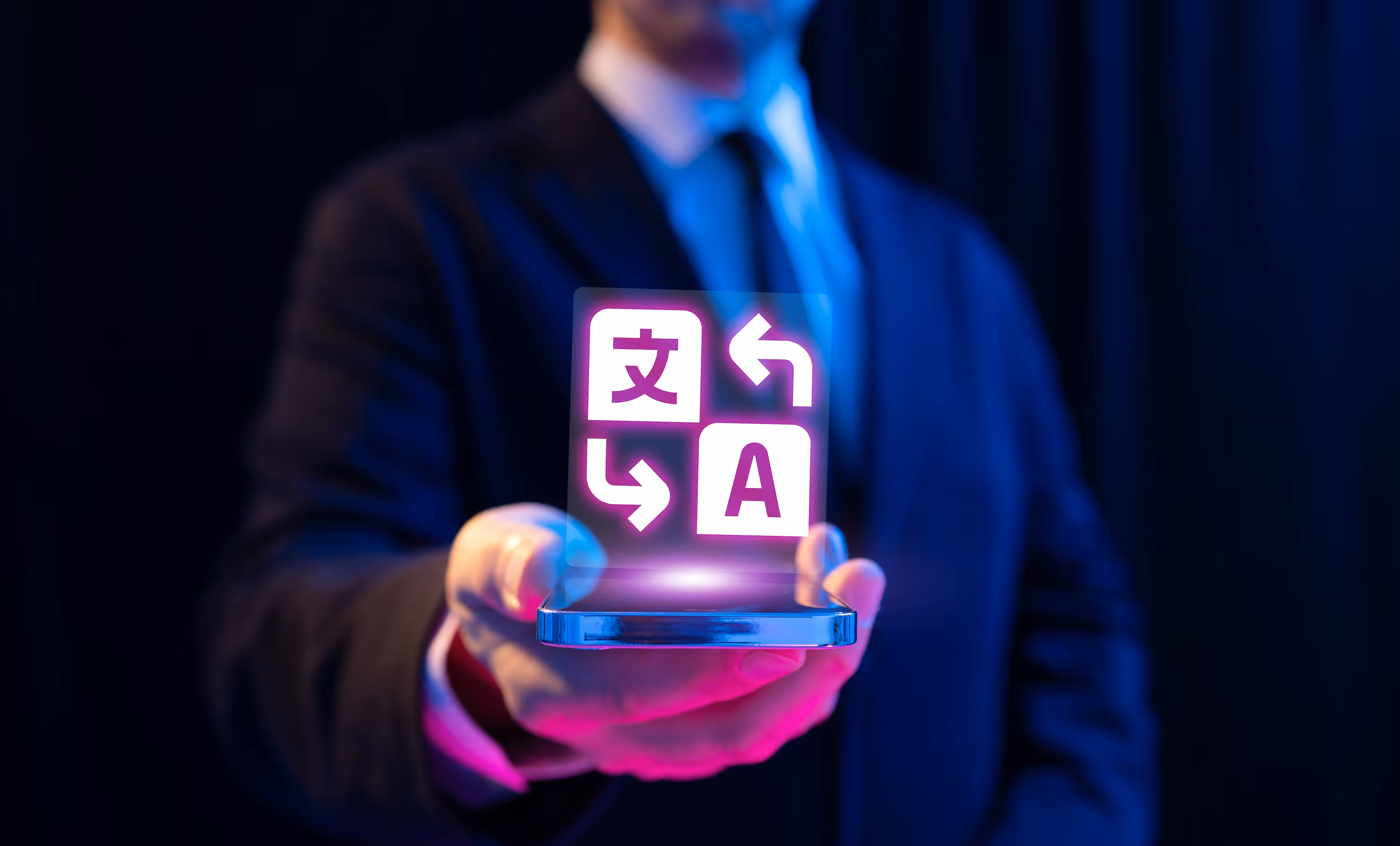 Person holds out a phone with a bubble floating above referencing how AI can be used for translation