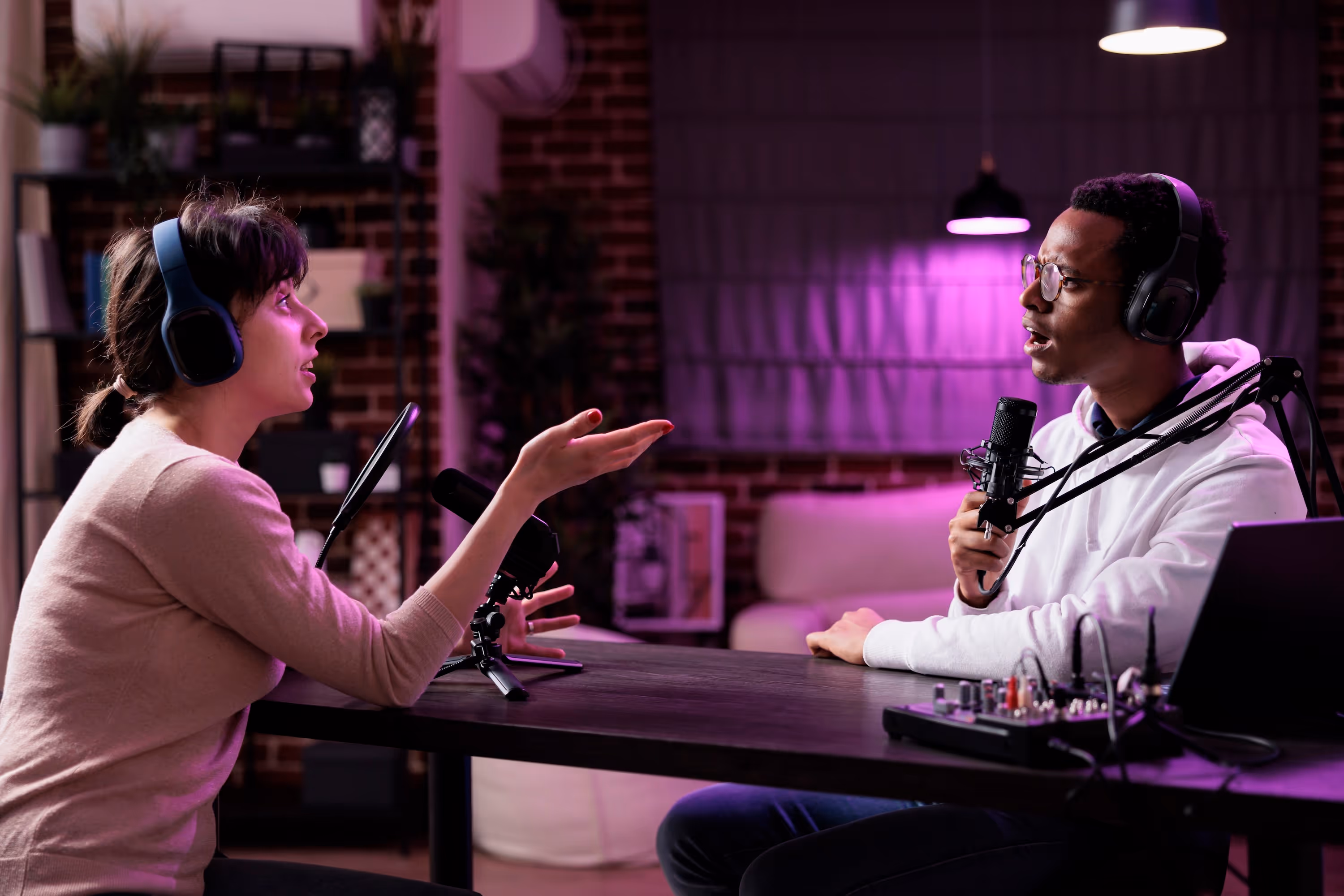 2 people intensely discussing in a podcast interview