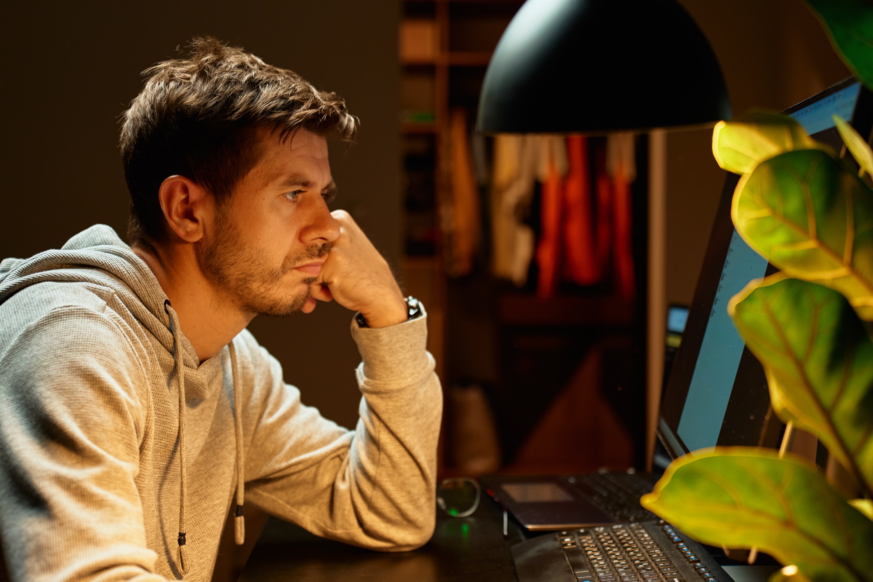 Man with screen fatigue staring at screen