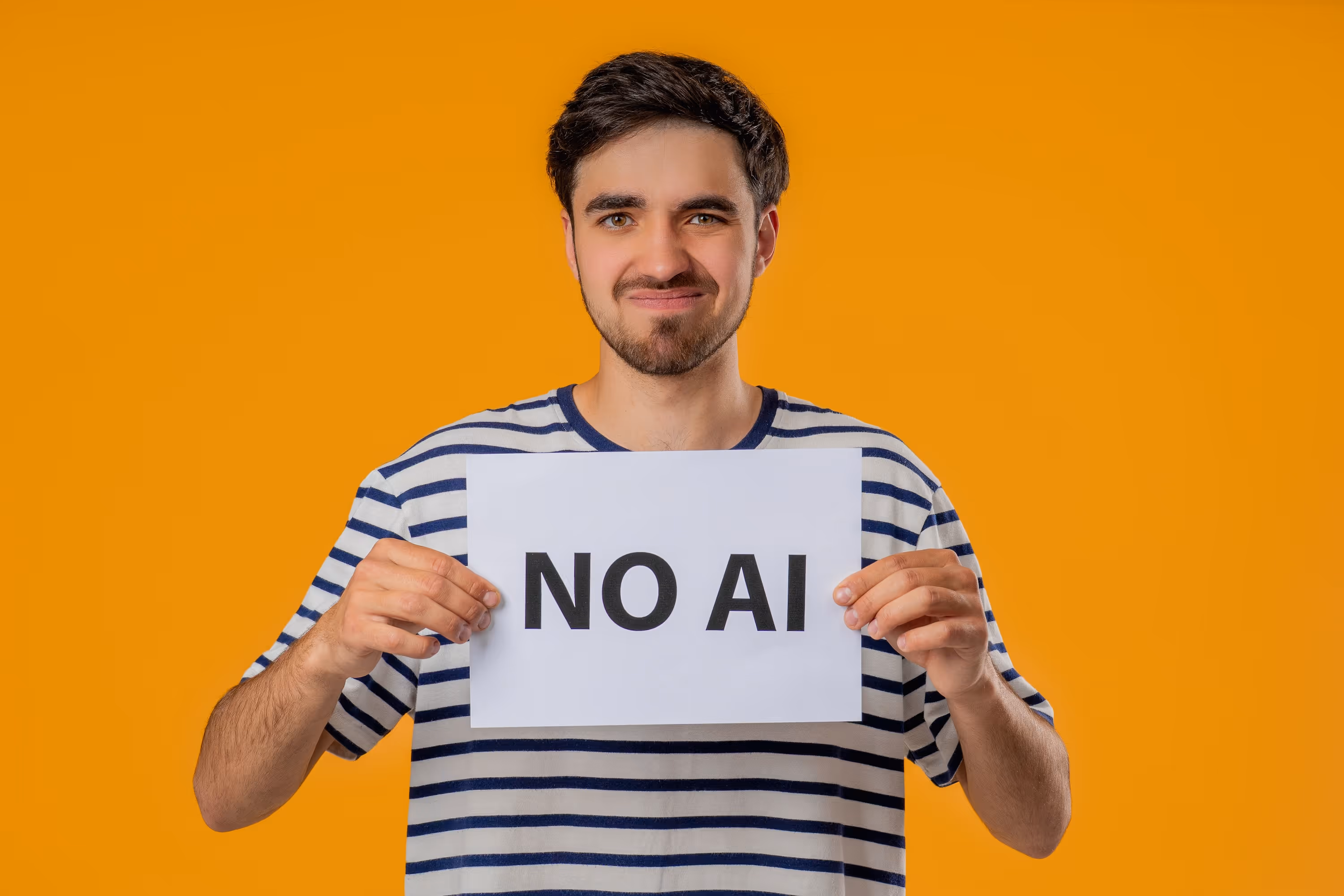 Man holding sign saying "No AI"