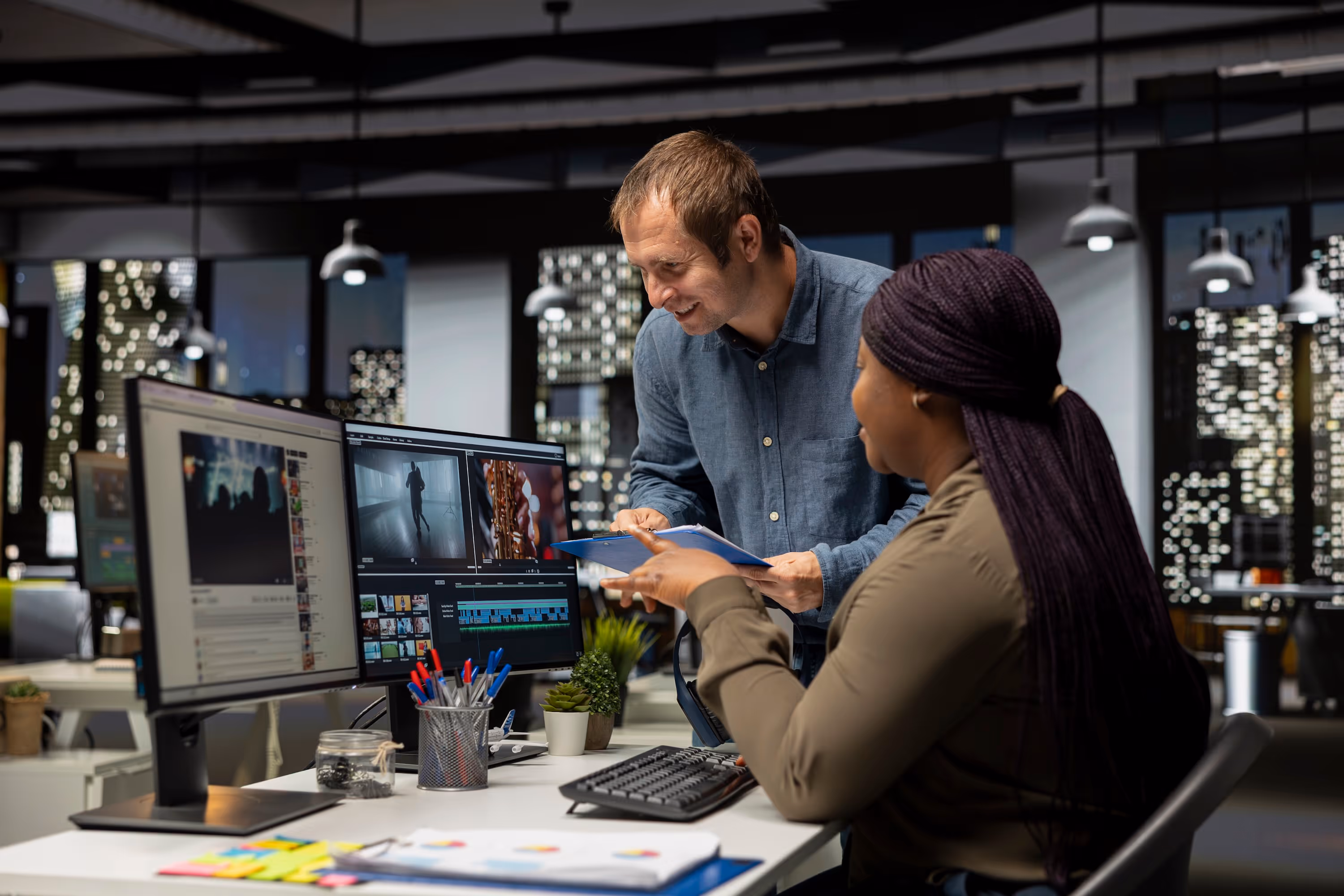 Man and woman editing video