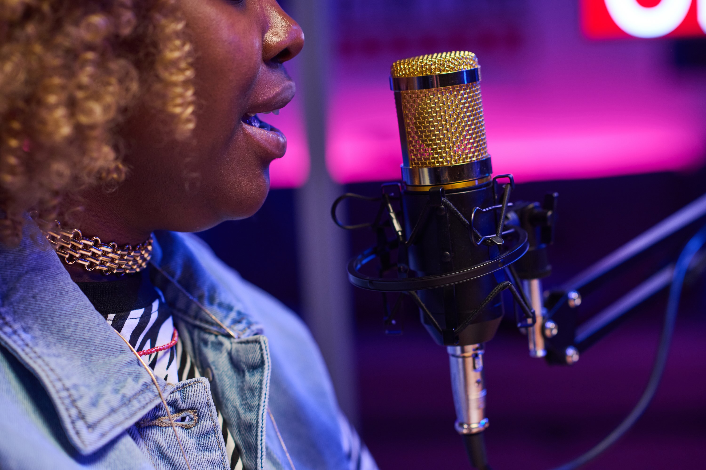 Close-up of woman recording podcast