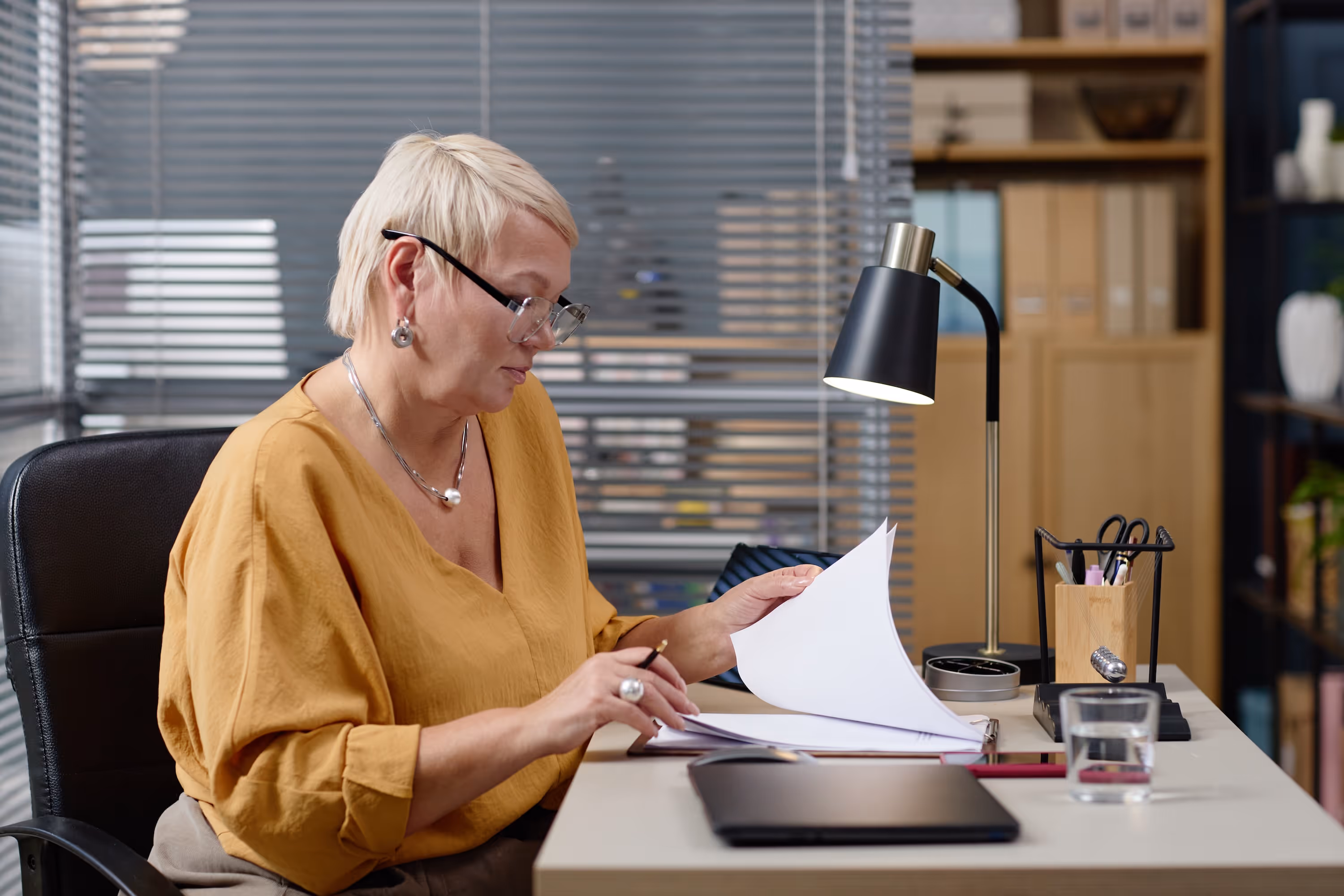 Woman reading and reviewing work