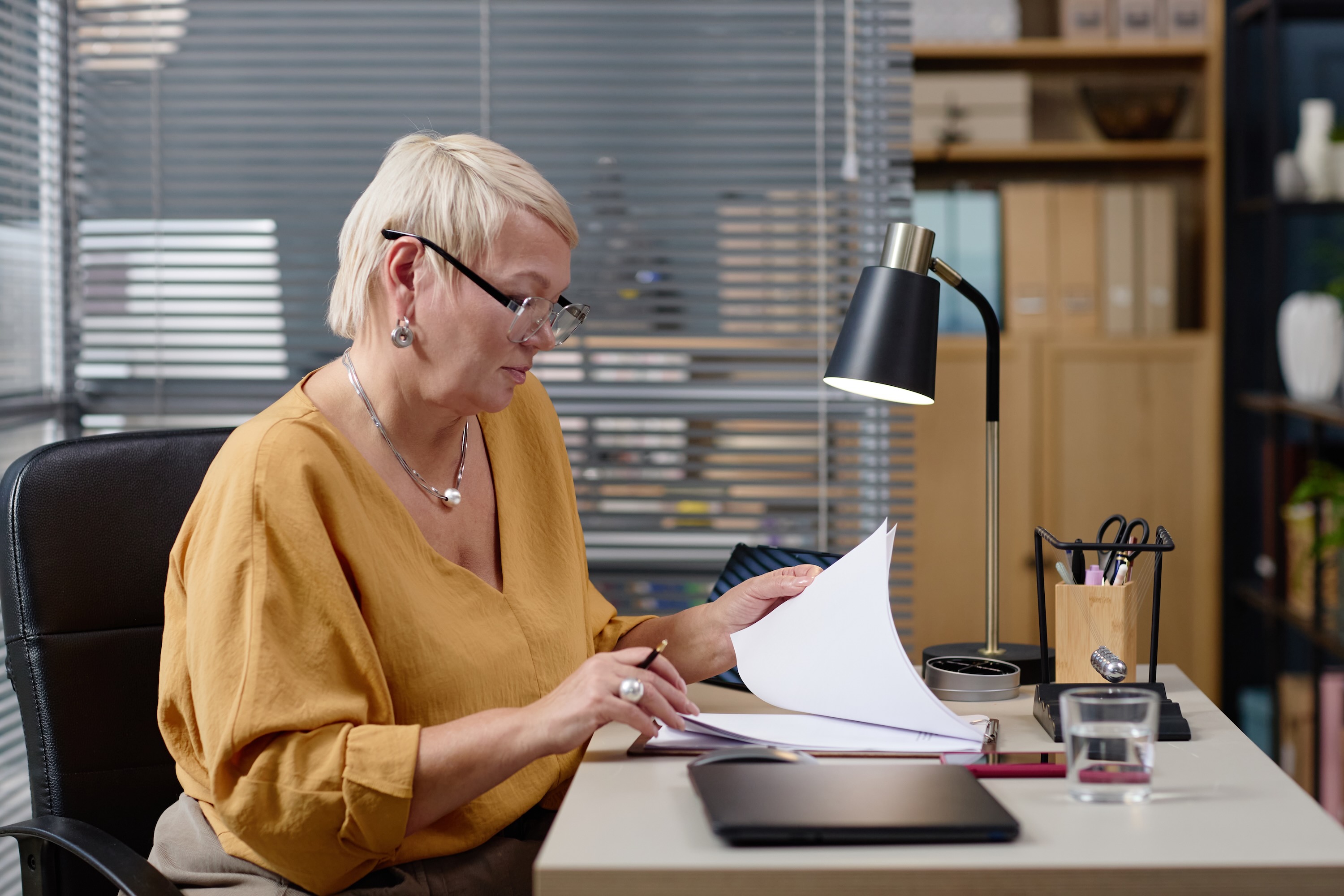 Woman reading and reviewing work