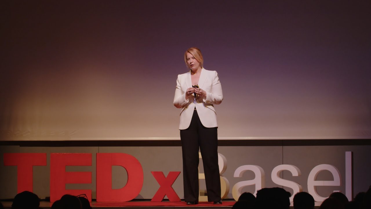 Jo Filshie Browning on stage doing her TED Talk