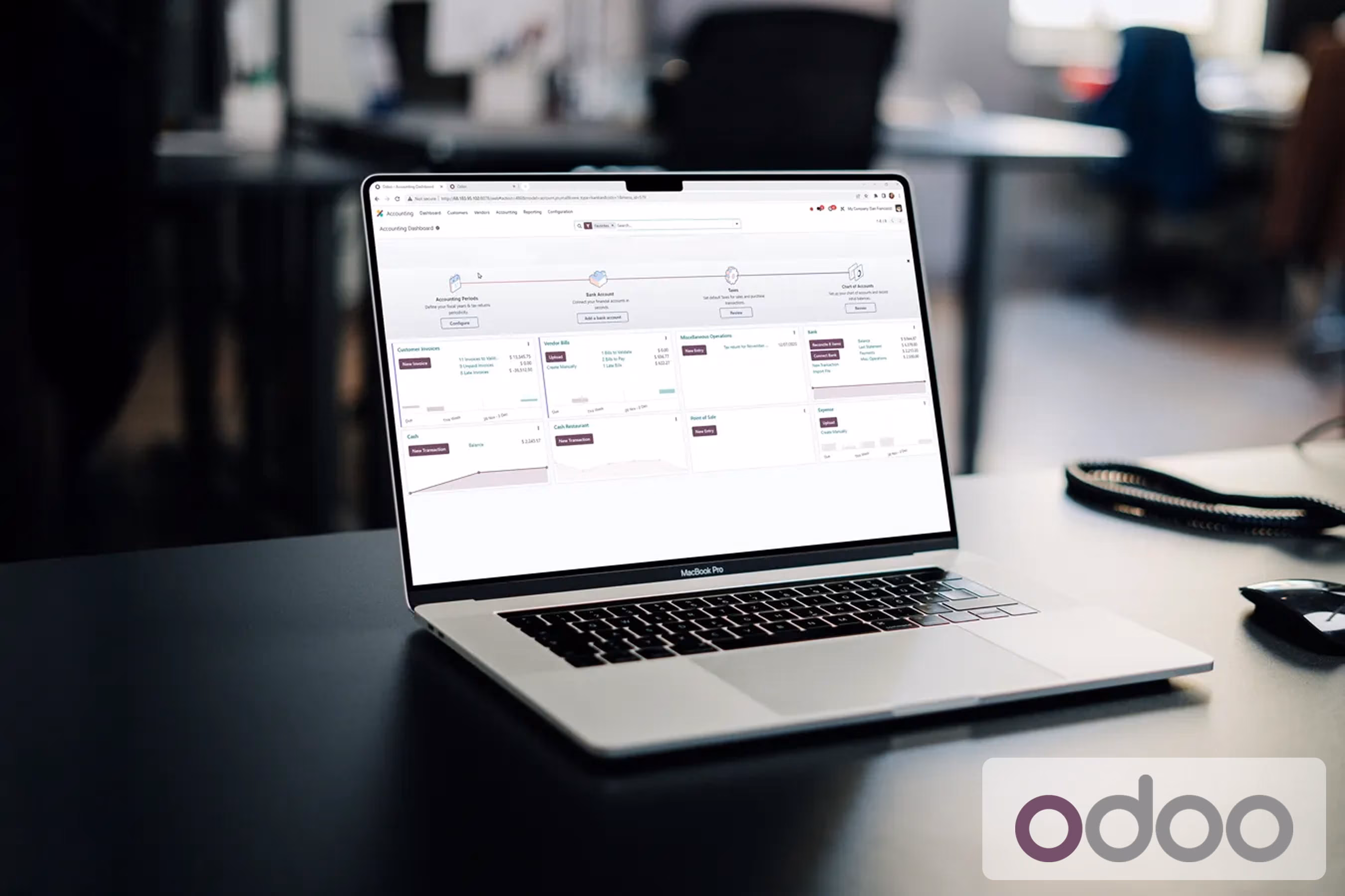 Open laptop on a desk displaying an accounting dashboard software interface with charts, balance summaries, and menu options for invoices, vendor bills, bank accounts, and expenses.