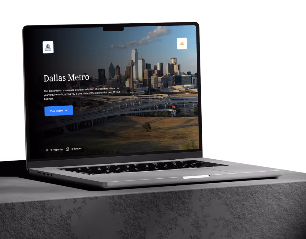 Open laptop on table showing a Dallas Metro business property report with city skyline and highways.