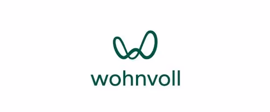 Logo mit grünem abstraktem Symbol über dem Schriftzug 'wohnvoll'.