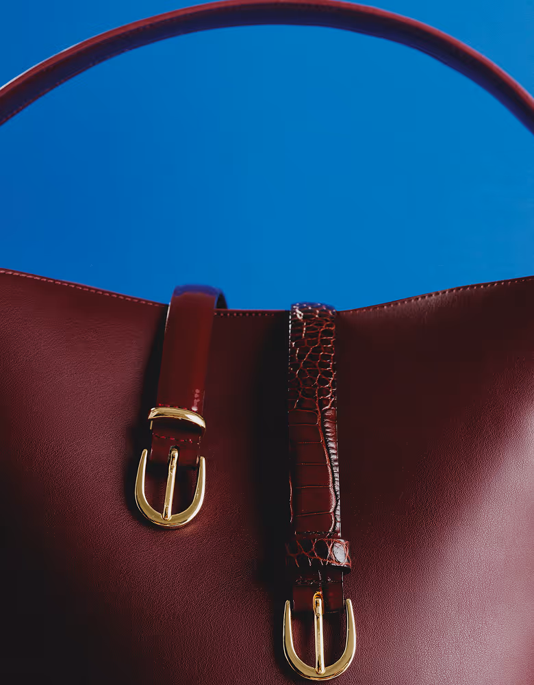 RW&Co Holiday 2025 Campaign Gift Guide burgundy bag closeup