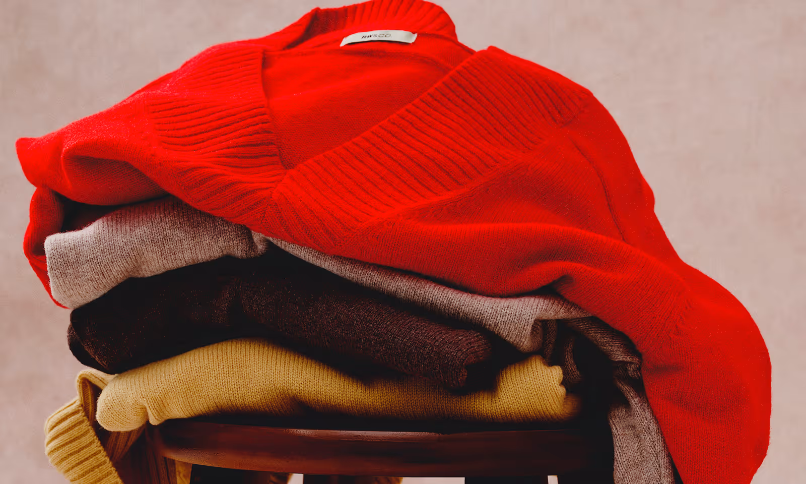 RW&Co Holiday 2025 Campaign Gift Guide Sweaters on stool
