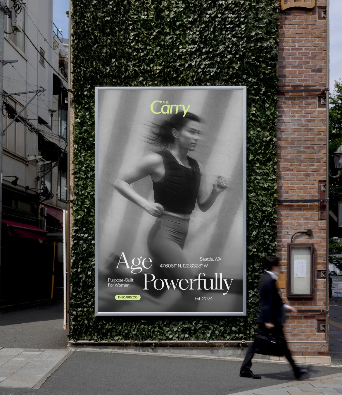 Outdoor advertisement on green wall showing a woman running with text 'Age Powerfully' and 'Purpose-Built For Women' in Seattle, WA.
