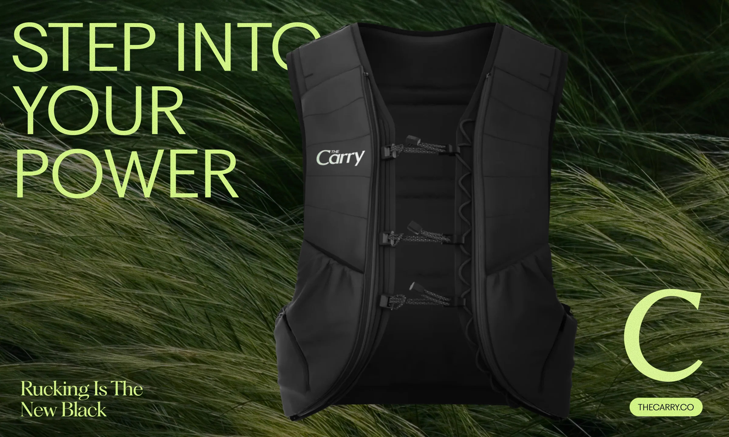 Black tactical vest with 'The Carry' logo displayed on a background of green grass, accompanied by the text 'Step into your power' and 'Rucking Is The New Black'.