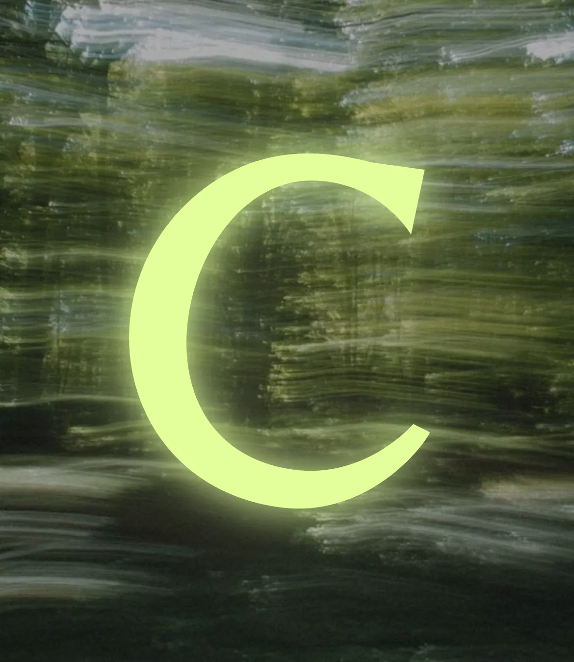 The Carry icon "C" glowing on a blurry forest background