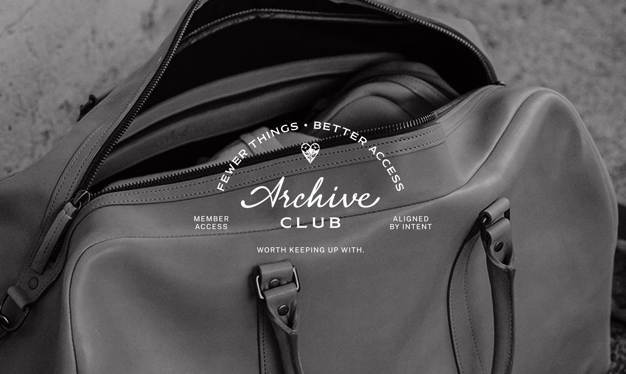 Black and white close-up of an open leather duffel bag with visible handles and a zippered compartment, featuring the text 'Fewer Things • Better Access, Archive Club, Member Access, Aligned by Intent, Worth Keeping Up With' overlaid in the center.
