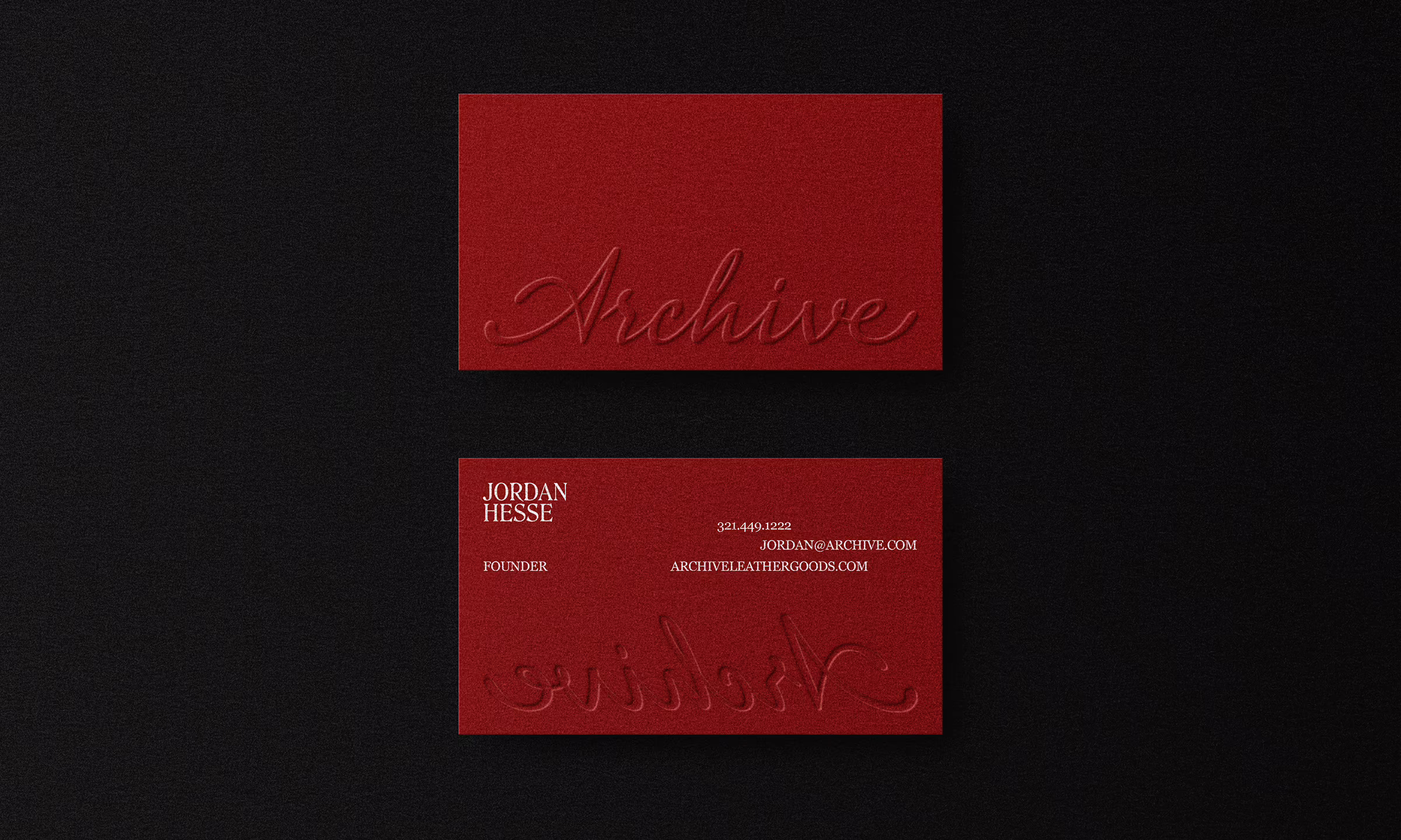 Two dark red business cards on a black background; the top card shows the embossed word 'Archive' in cursive, and the bottom card displays contact details for Jordan Hesse, founder, with phone number, email, and website, along with the same embossed cursive text reversed.
