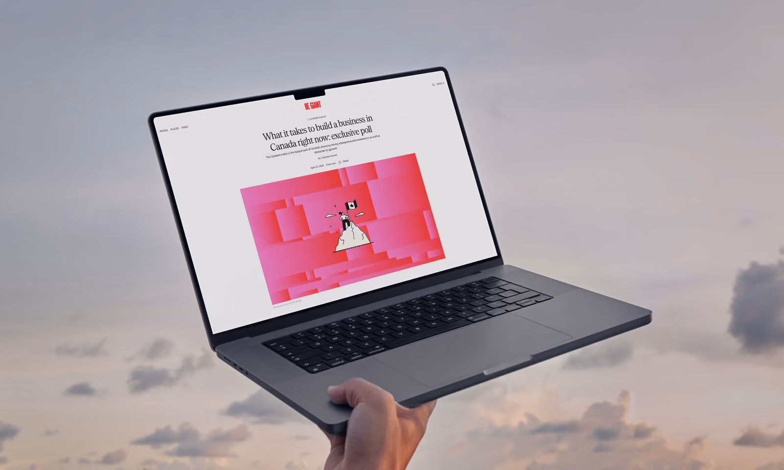 Hand holding a laptop against a cloudy sky background; the laptop screen displays a webpage titled 'What it takes to build a business in Canada right now: exclusive poll' with a pink geometric illustration below the title.