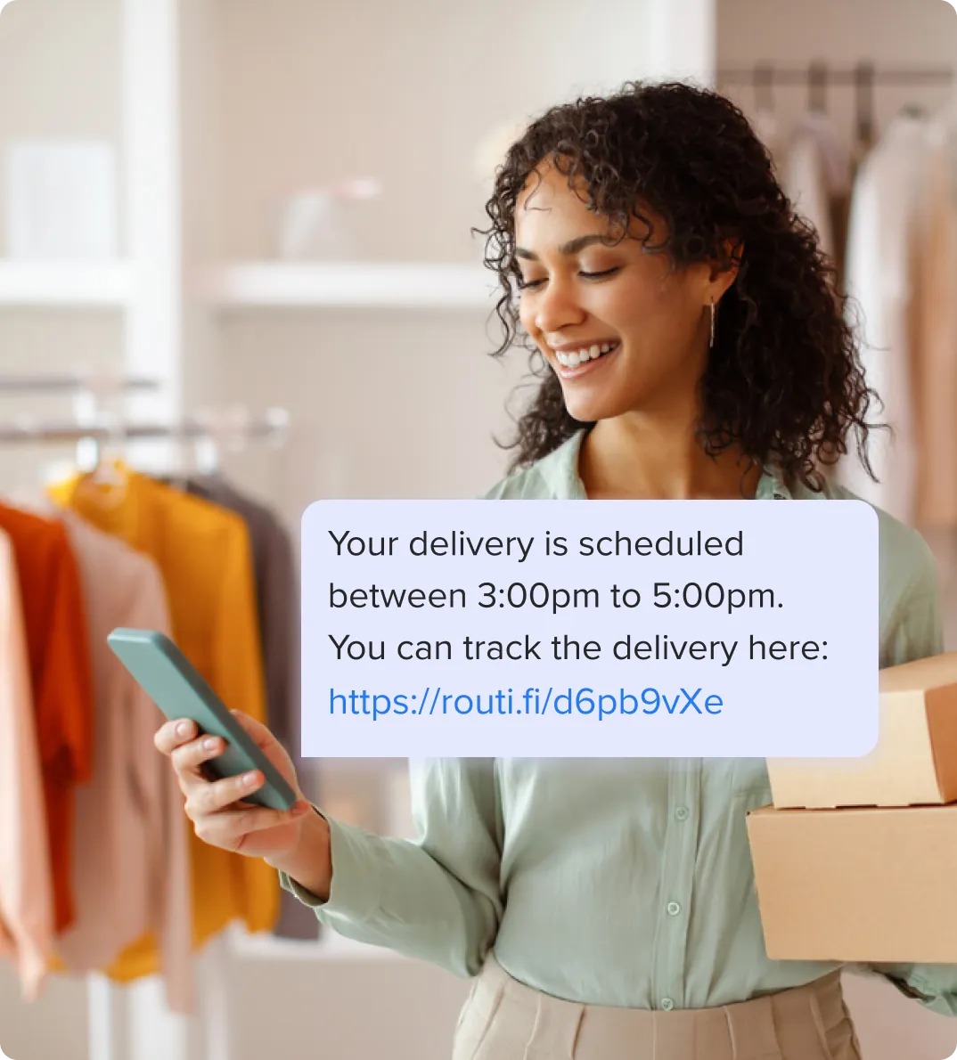 A customer checks a delivery notification from Routific on her phone. It confirms her flowers are due to be delivered between 3:00 pm and 5:00 pm, and includes a live tracking link.