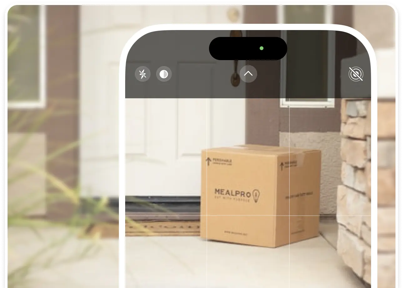 A meal delivery box is framed on a customer’s doorstep as the delivery driver takes a POD photo using their phone camera.