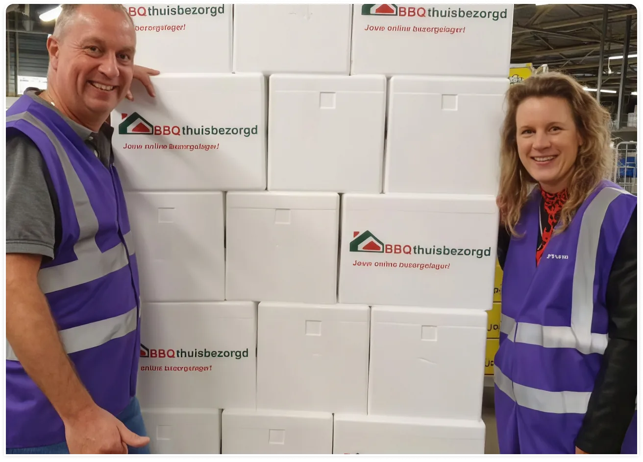 Trunkrs staff pose with a large pile of boxes for delivery.