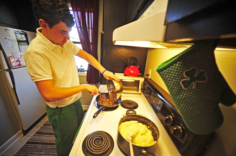 Arthur King teaches other students how to cook tasty meals on a budget, in his popular YouTube series "Cookin' for College." 