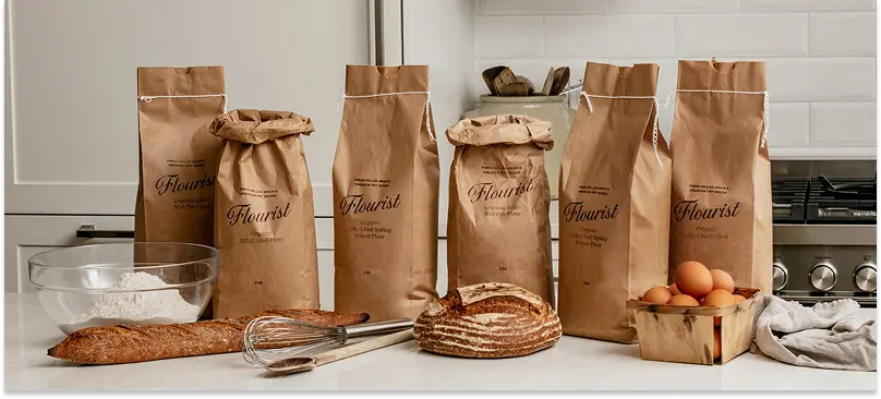 Bags of flour and fresh-baked bread from Flourist.